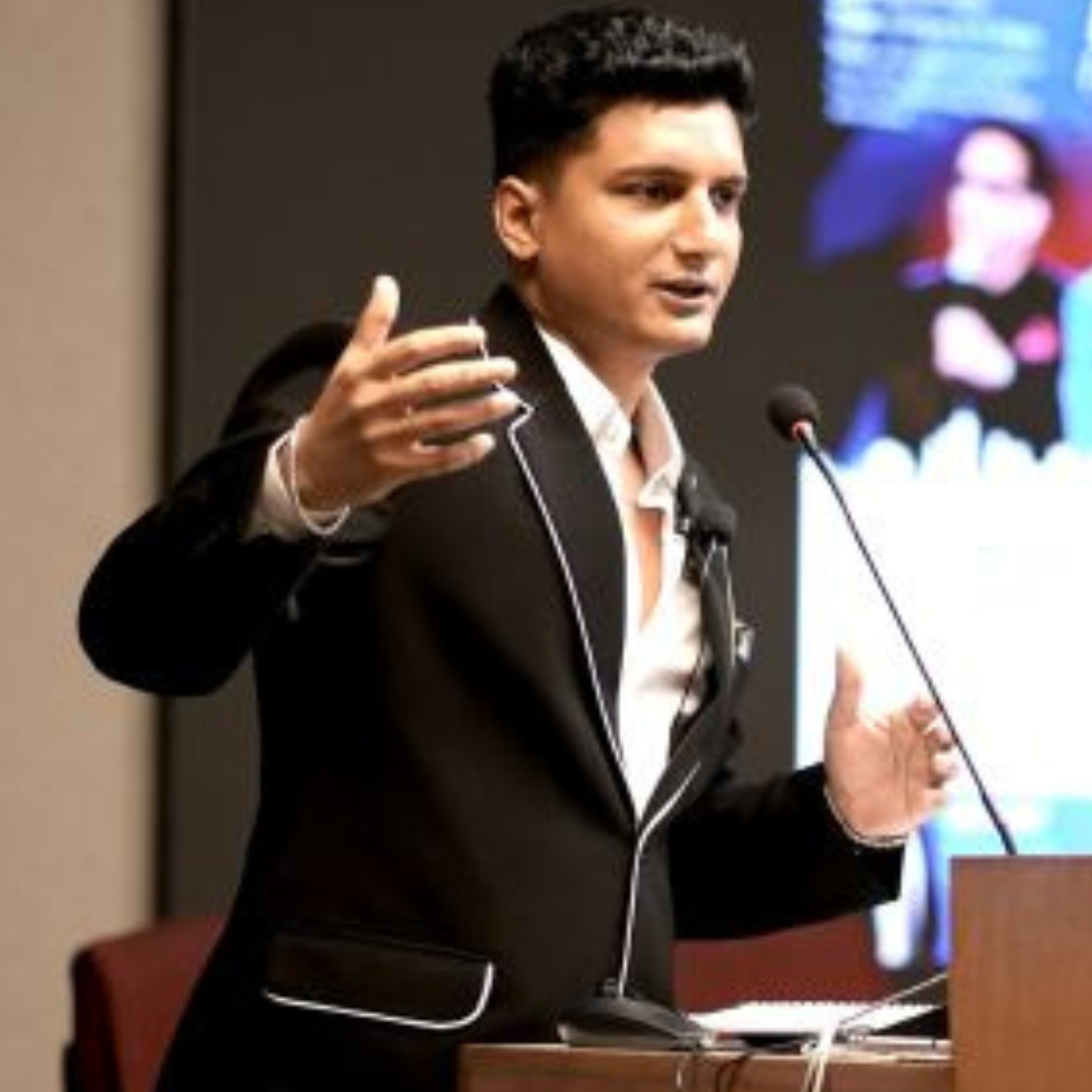 Portrait of Ashutosh Arya speaking at a conference